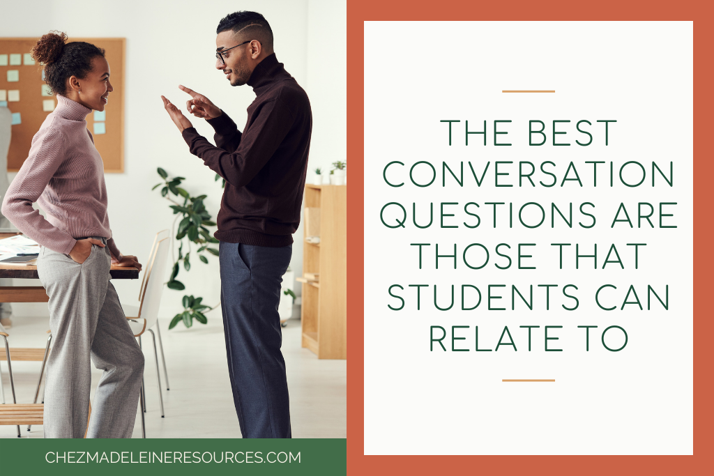Two students standing and talking in a classroom using French conversation prompts. The text reads "The best conversation questions are those that students can relate to."